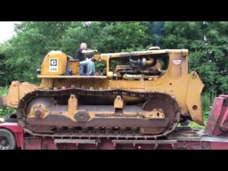 Caterpillar D9G donkey start and unloading off a low loader