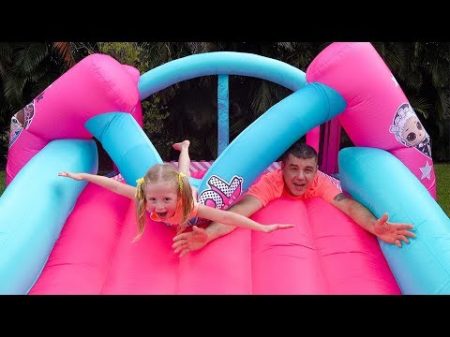 Stacy and dad fun playing with Inflatable water slide